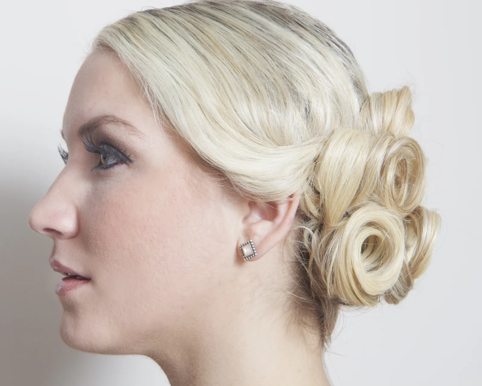 Profile Photographic Portrait of a Blonde Young Woman.