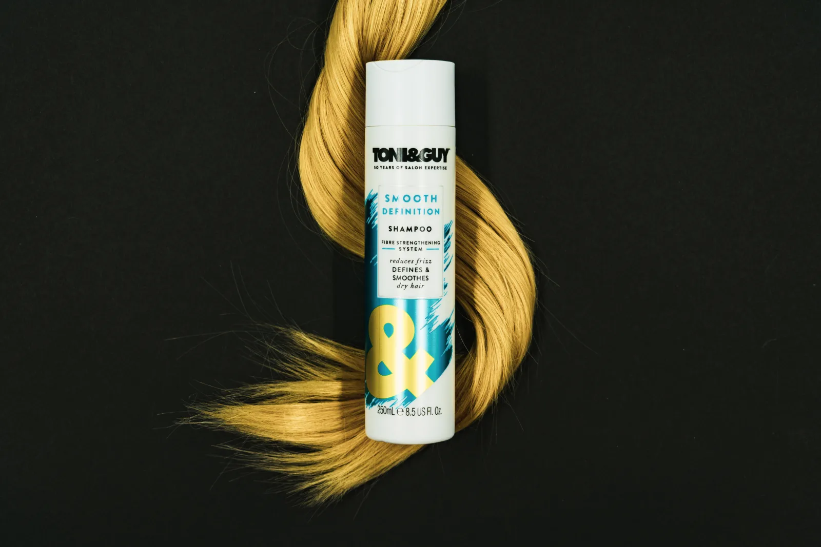 In the image a bottle of Toni &amp; Guy shampoo can be seen alongside a weft of shiny, healthy hair. This photograph has been released under Creative Commons which means we're happy for you use it in any way you wish. But please credit us as the original image owners when you do by providing a link to geehair.com/