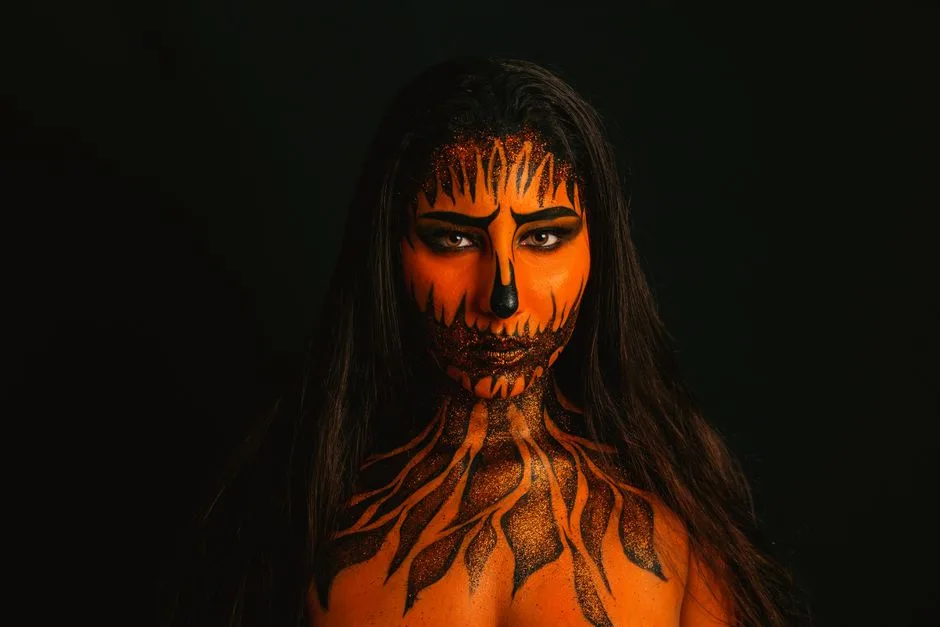A striking portrait with intricate Halloween face paint on a woman.