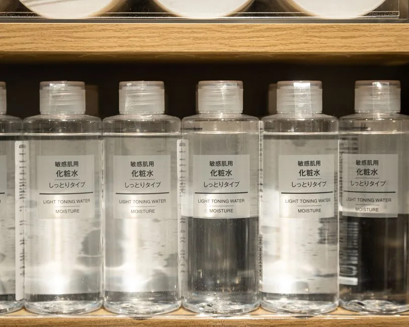 Close-up of Muji light toning water moisture bottles on a shelf.