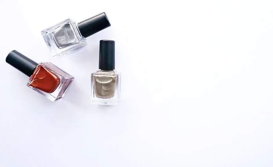 Three nail polish bottles arranged elegantly against a white background.