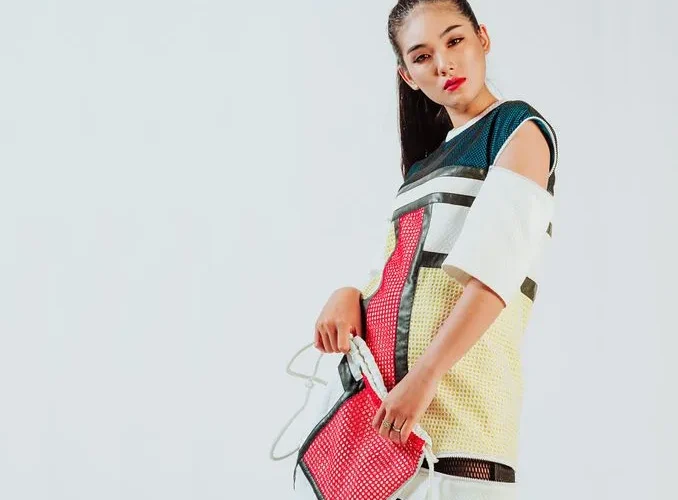 Portrait of a young woman in a trendy, colorful outfit, embodying modern fashion elegance.