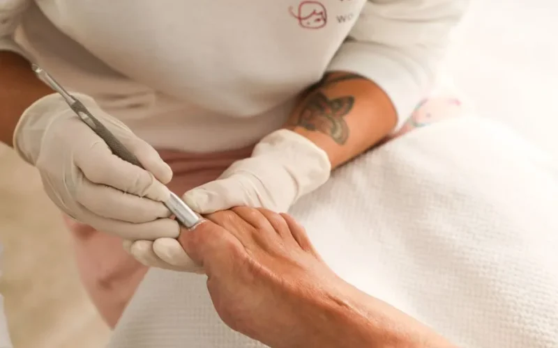Close-up of a professional manicure service being performed in a salon with attention to detail.