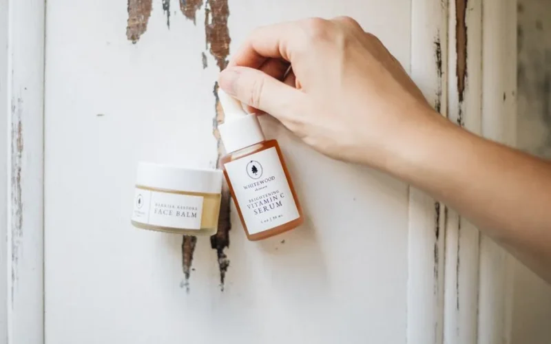 Elegant skincare display featuring face balm and vitamin C serum, showcasing minimalist beauty.