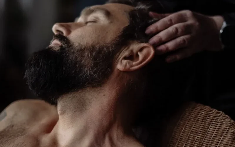 Gentle head massage therapy session for relaxation and stress relief.